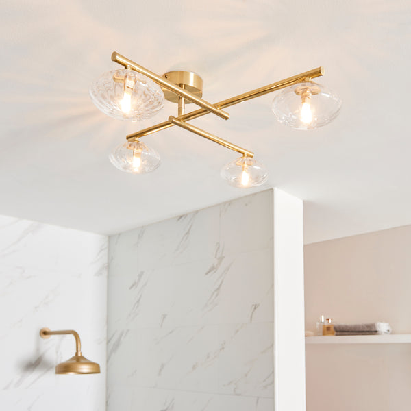 Mobias 4 Light Bathroom Ceiling Light in satin brass on a bathroom ceiling