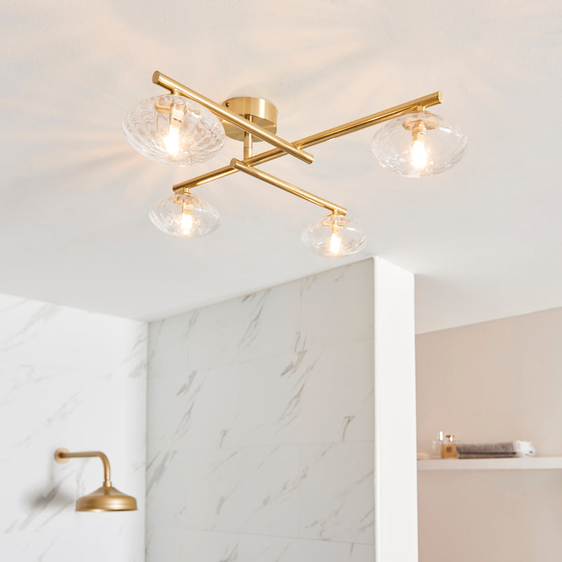 Mobias 4 Light Bathroom Ceiling Light in satin brass on a bathroom ceiling
