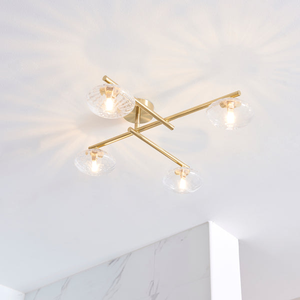 Mobias 4 Light Bathroom Ceiling Light lit up in a styled bathroom