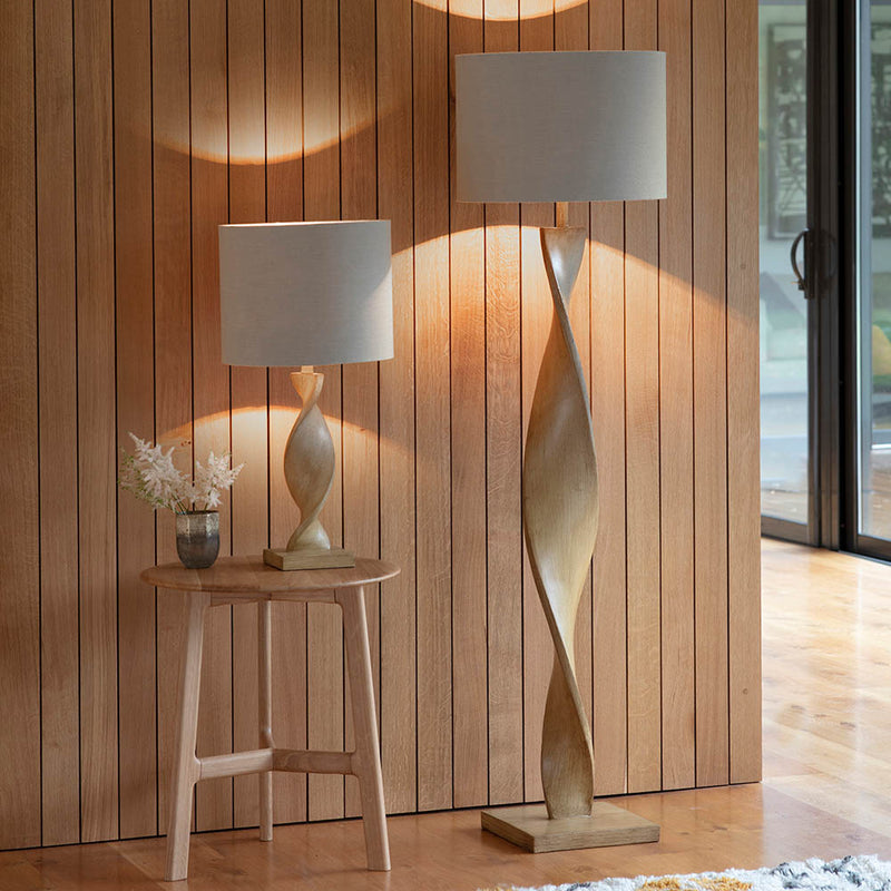 Abia Floor Lamp lit up in a living room setting