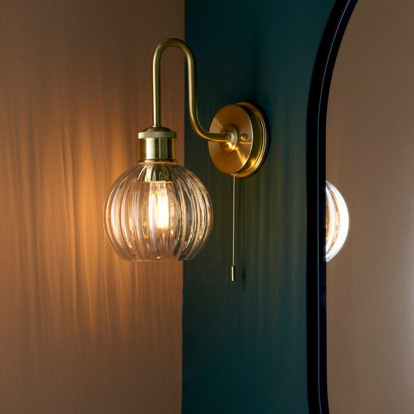Kendall Bathroom Wall Light in satin brass on a wall