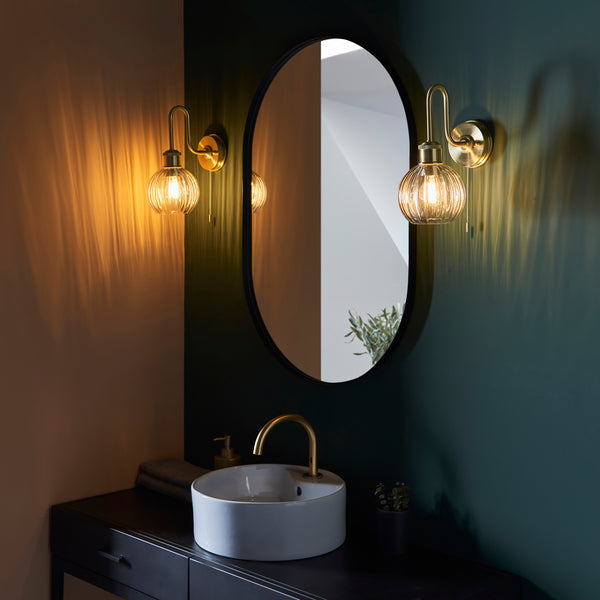 Kendall Bathroom Wall Light in satin brass shown in a room setting