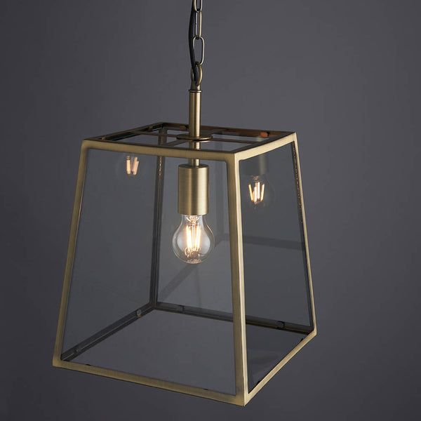 Hurst Lantern Pendant in matt antique brass shown in a room setting