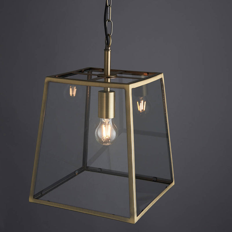 Hurst Lantern Pendant in matt antique brass shown in a room setting
