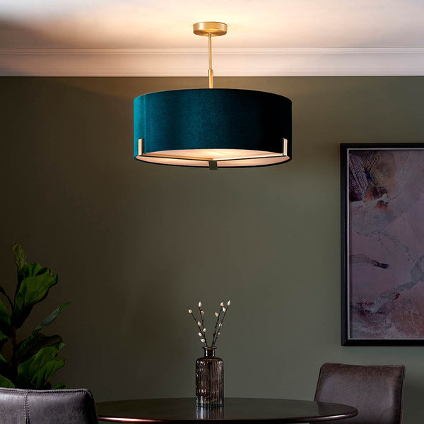 Hayfield 3 Light Drum Pendant lit up in a styled living room