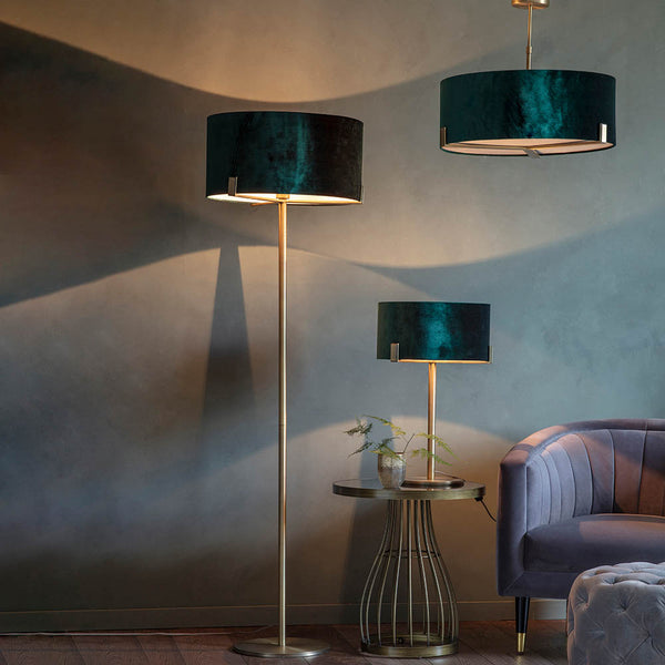 Hayfield 3 Light Drum Pendant in antique brass and green velvet shown in a room setting