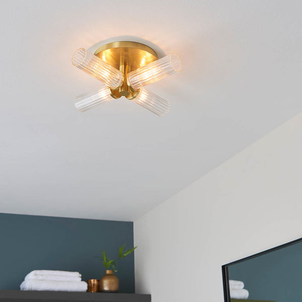 Talo 4 Light Bathroom Ceiling Light lit up in a styled bathroom