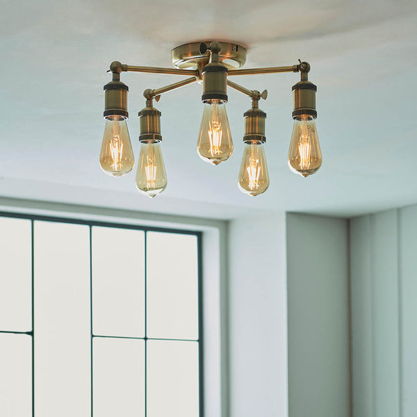 Hal 5 Light Semi Flush Ceiling Light in antique brass shown in a room setting
