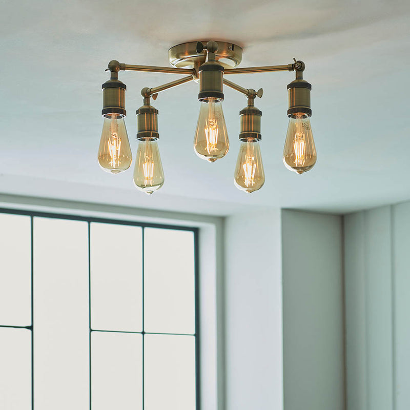 Hal 5 Light Semi Flush Ceiling Light in antique brass shown in a room setting