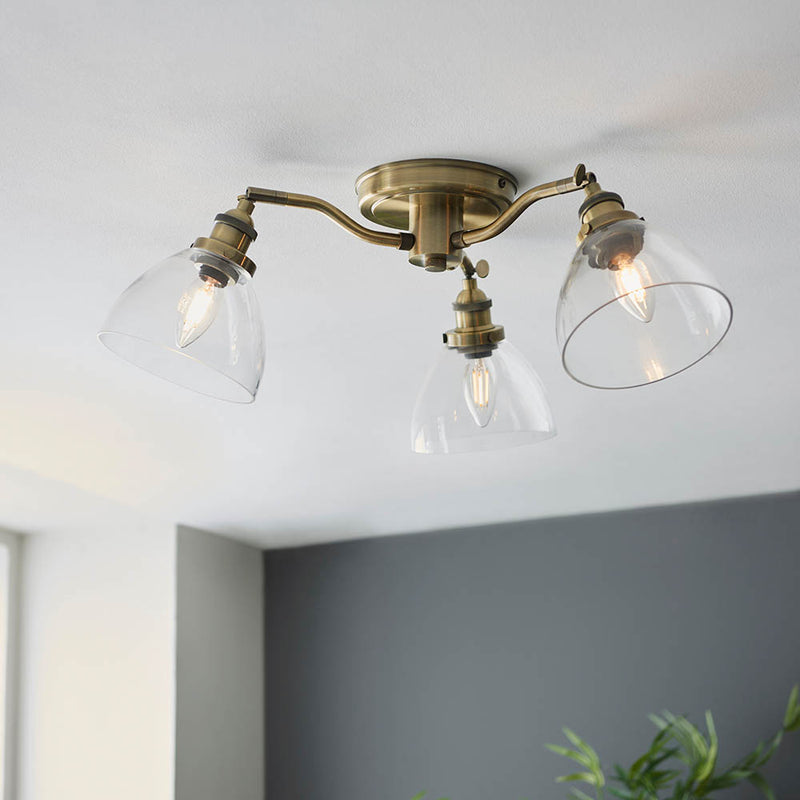 Hansen 3 Light Semi Flush Ceiling Light in antique brass on a kitchen ceiling