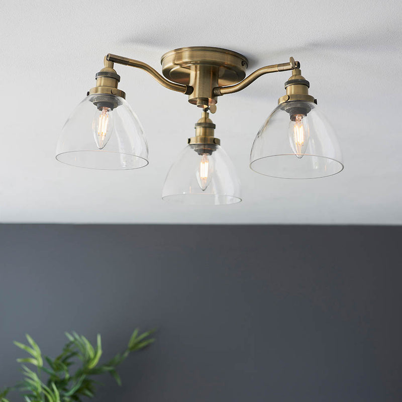 Hansen 3 Light Semi Flush Ceiling Light lit up in a styled kitchen