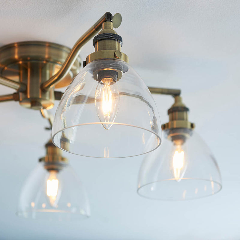 Detail of the antique brass finish on the Hansen 5 Light Semi Flush Ceiling Light