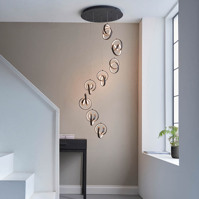 Cosma 8 Light LED Cluster Pendant lit up in a styled stairwell
