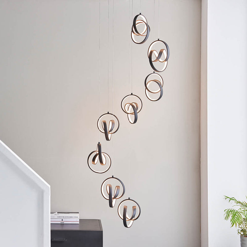 Cosma 8 Light LED Cluster Pendant in textured black shown in a room setting