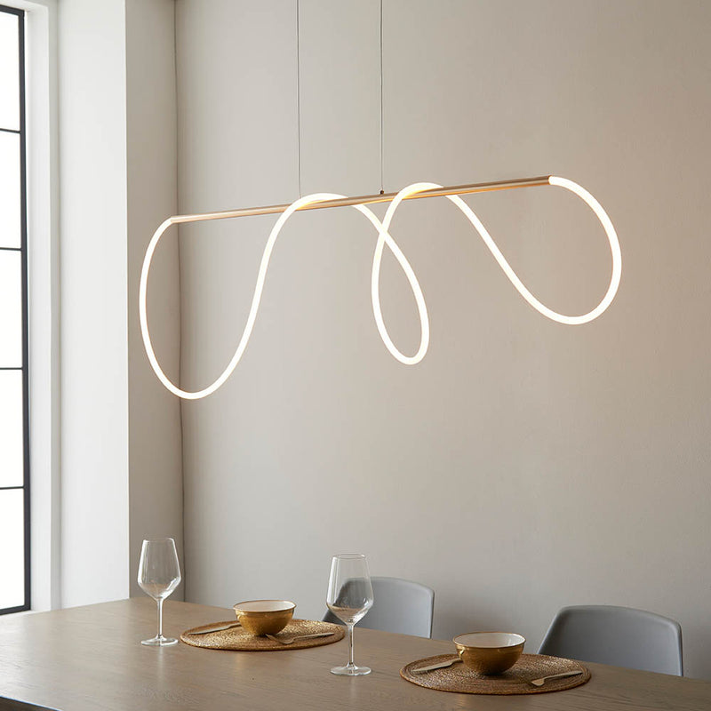 Attalea LED Linear Pendant in satin gold shown in a room setting
