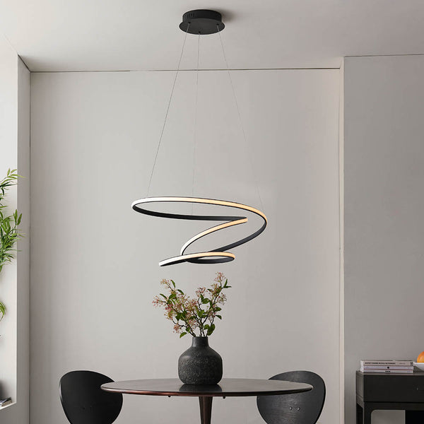 Dune LED Pendant in textured black shown in a room setting