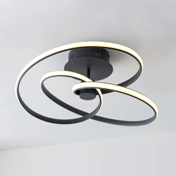 Dune LED Semi Flush Ceiling Light in textured black on a living room ceiling
