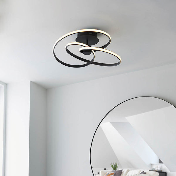 Dune LED Semi Flush Ceiling Light lit up in a styled living room