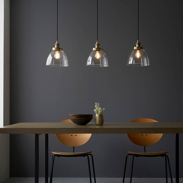 Hansen 3 Light Linear Pendant lit up in a styled kitchen