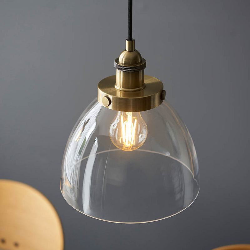 Detail of the antique brass finish on the Hansen 3 Light Linear Pendant