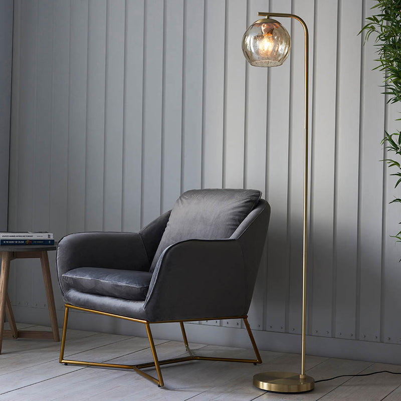 Endon Dimple Floor Lamp in satin brass in a styled living room