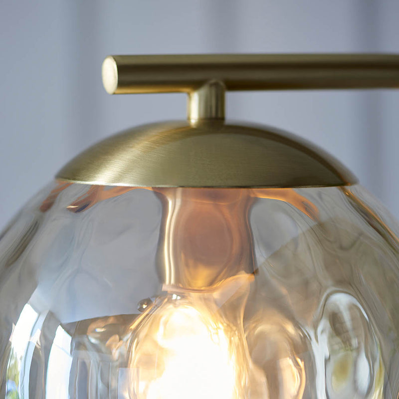 Detail of the satin brass finish on the Dimple Floor Lamp