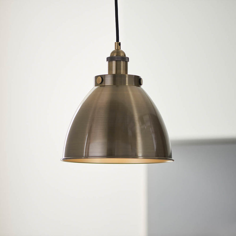 Franklin Small Pendant in antique brass hanging in a kitchen