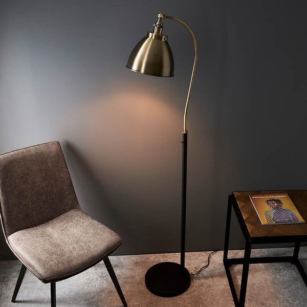 Franklin Task Floor Lamp lit up in a living room setting