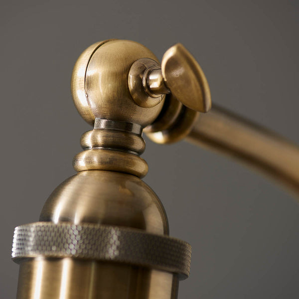 Detail of the antique brass and matt black finish on the Franklin Task Floor Lamp