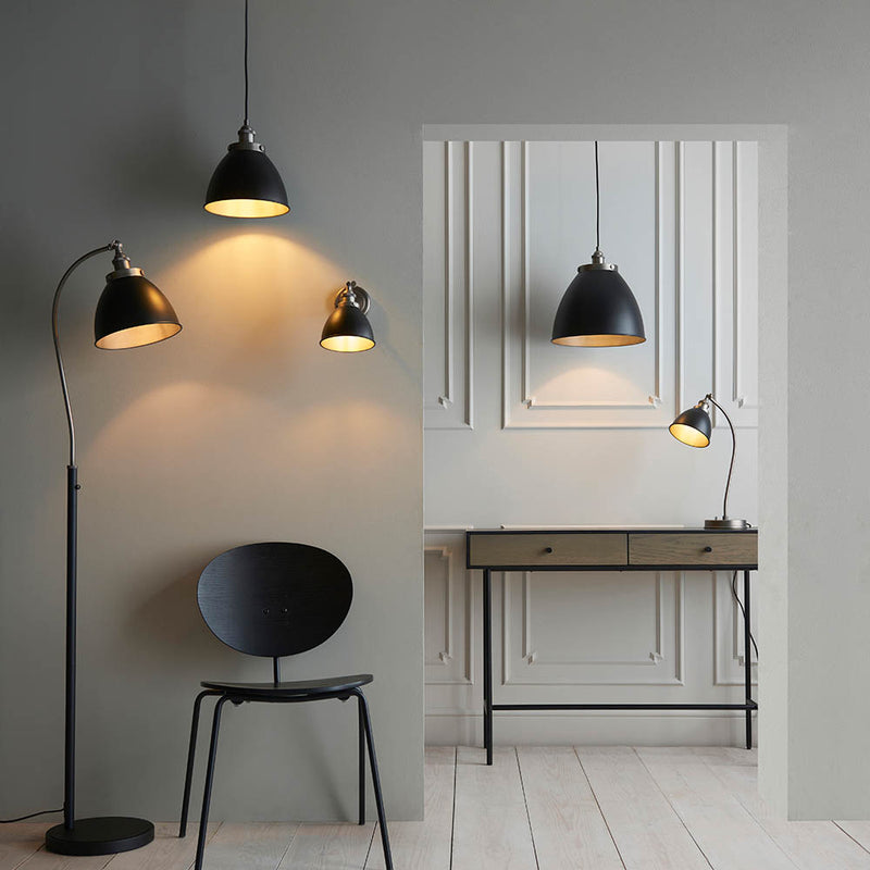 Franklin Task Floor Lamp lit up in a living room setting
