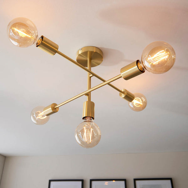 Studio 5 Light Semi Flush Ceiling Light in satin brass shown in a room setting