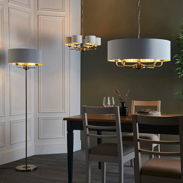 Highclere 8 Light Drum Pendant in antique brass shown in a room setting