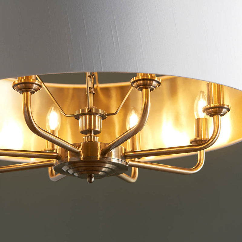 Detail of the antique brass finish on the Highclere 8 Light Drum Pendant