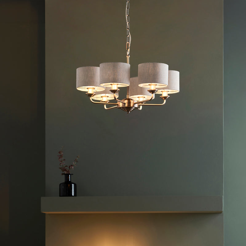 Highclere 6 Light Pendant in brushed chrome hanging in a living room