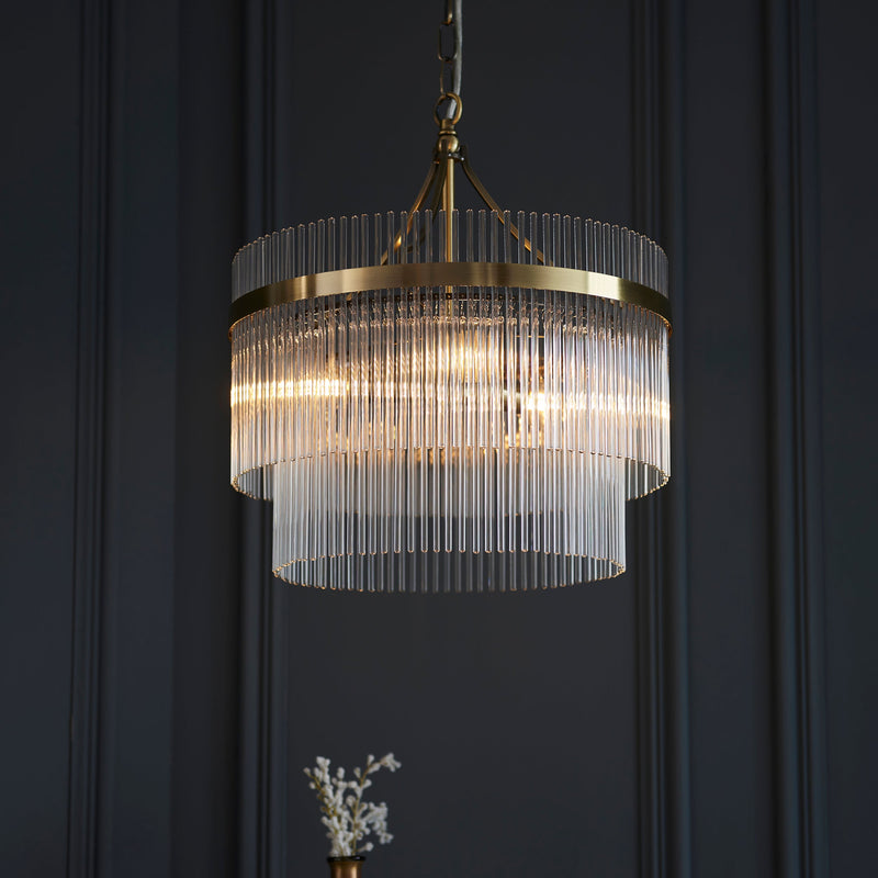 Endon Marietta 3-Light Pendant Drum Light Antique Brass – A contemporary chandelier with an antique brass finish and decorative clear glass rods. Height-adjustable and dimmable, this elegant pendant light is perfect for dining rooms, living spaces, and entryways, offering a warm, sophisticated glow.