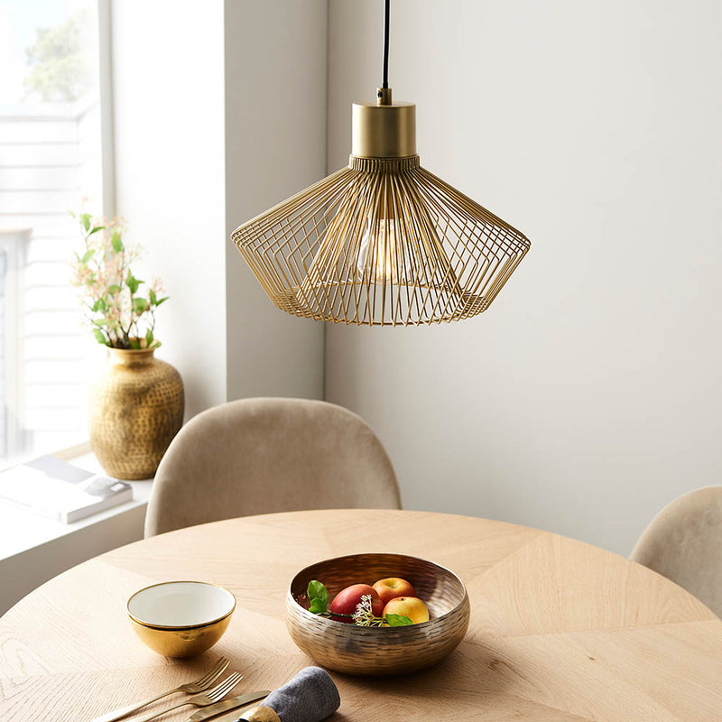 Kimberley Cage Pendant in gold shown in a room setting