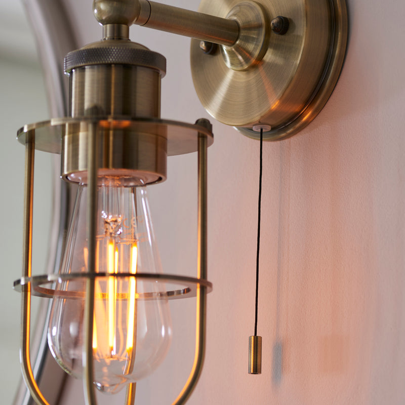 Detail of the antique brass finish on the Crew Bathroom Wall Light