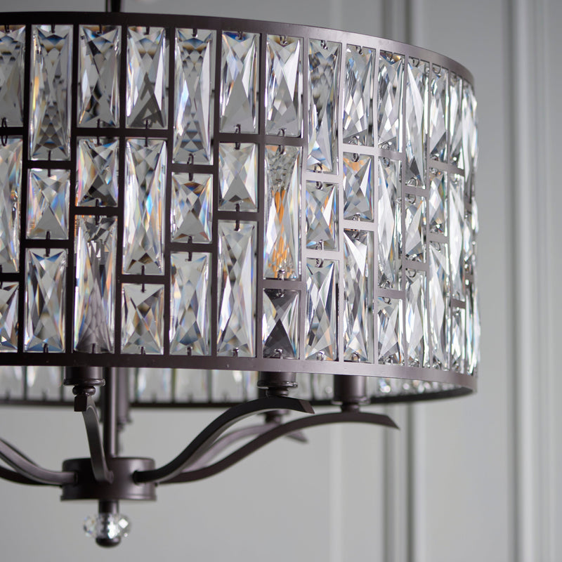 Endon The Belle 8 light pendant mixes high quality faceted clear crystals, arranged in a striking tiered pattern, with an understated dark bronze effect finish. Once lit each crystal combines to create an intensified decorative light effect. Perfect for timeless classic interiors.
