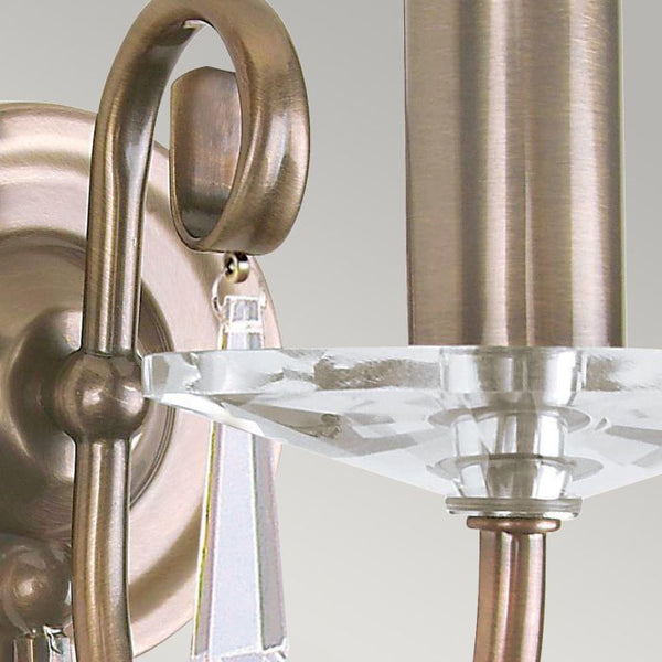 Elstead Aegean 1 Light Wall Light in aged brass, featuring hand-forged scrollwork, cut glass droplets, and a timeless classical design. Ideal for elegant interiors with dimmable functionality.