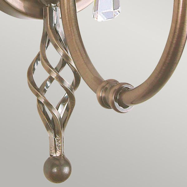 Elstead Aegean 1 Light Wall Light in aged brass, featuring hand-forged scrollwork, cut glass droplets, and a timeless classical design. Ideal for elegant interiors with dimmable functionality.