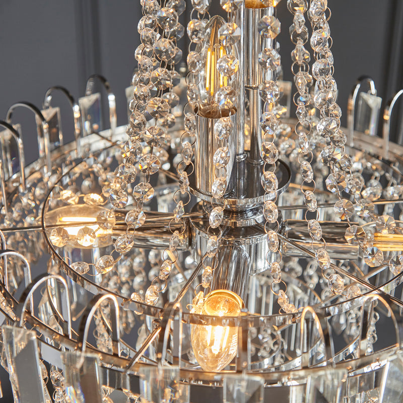 Close-up of a chandelier with crystal beads and gold accents.