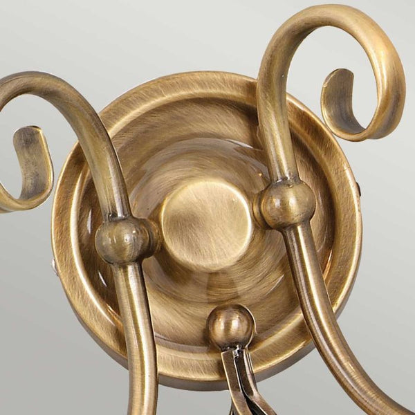 Elstead Artisan 2 Light Wall Light in aged brass, featuring intricate scrollwork, knot twist detailing, and a durable steel build, perfect for traditional interiors.