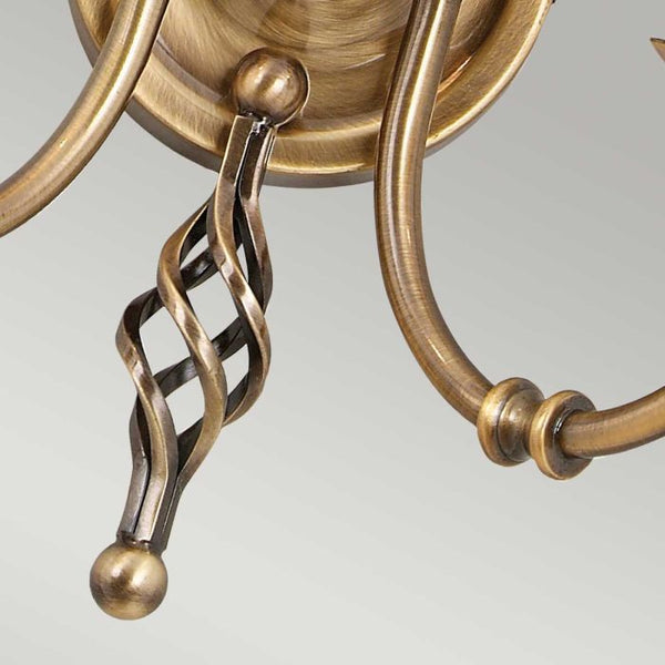 Elstead Artisan 2 Light Wall Light in aged brass, featuring intricate scrollwork, knot twist detailing, and a durable steel build, perfect for traditional interiors.