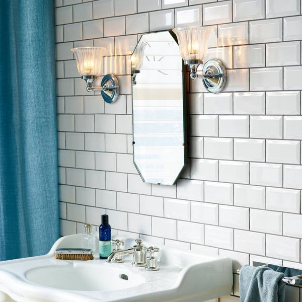 Austen 1 Light Wall Light in polished chrome, IP44-rated for bathroom use. Elegant, solid brass construction with a timeless design.