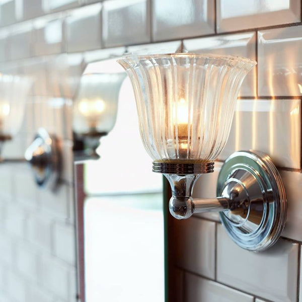 Austen 1 Light Wall Light in polished chrome, IP44-rated for bathroom use. Elegant, solid brass construction with a timeless design.