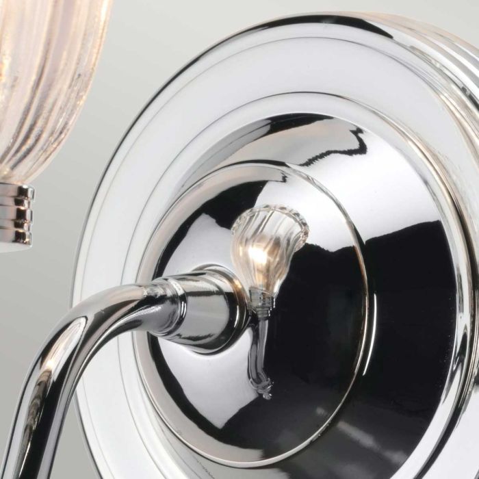 Elstead Carroll 1 Light Wall Light in polished chrome with a solid brass build and sleek finish. IP44-rated for bathroom use, includes a 3W LED G9 bulb. Provides warm 3000K illumination with a stylish design.