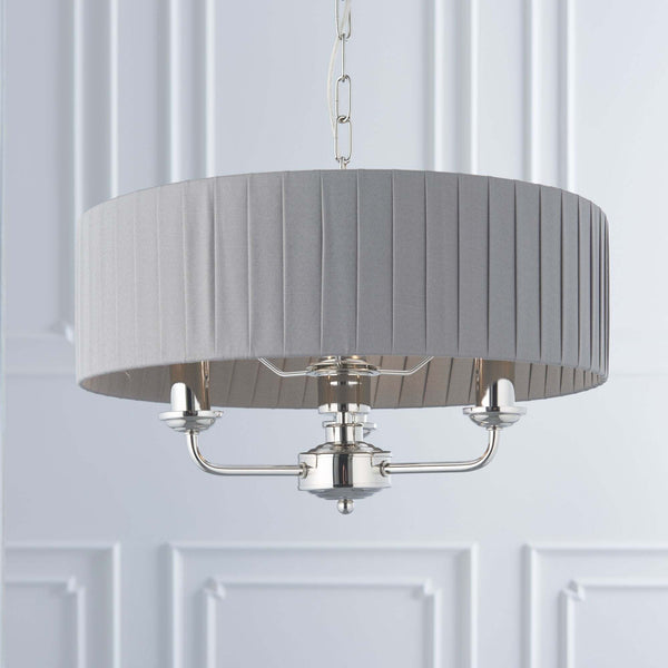 Endon Highclere 3-Light Pendant Drum Light Bright Nickel & Charcoal – A sophisticated pendant light featuring a charcoal silk mix fabric shade, bright nickel metalwork, and three elegant arms. Height-adjustable and dimmable, this statement lighting piece is perfect for dining rooms, living rooms, and stylish interiors.