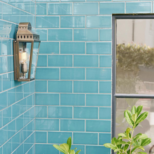 Aged brass Mansion House 1 Light Wall Lantern featuring a classic pre-Georgian British design with clear glass panels. Handcrafted for durability and finished with a lacquered aged brass coating, ideal for elegant outdoor spaces.
