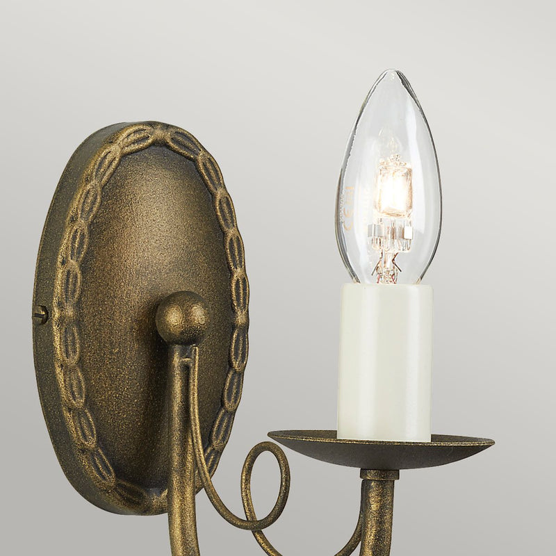 Elstead Minster 1 Light Wall Light in black and gold patina, featuring elegant drapes. Compact steel design, dimmable, and compatible with optional glass shades.