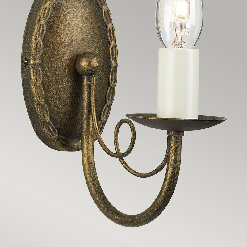 Elstead Minster 1 Light Wall Light in black and gold patina, featuring elegant drapes. Compact steel design, dimmable, and compatible with optional glass shades.